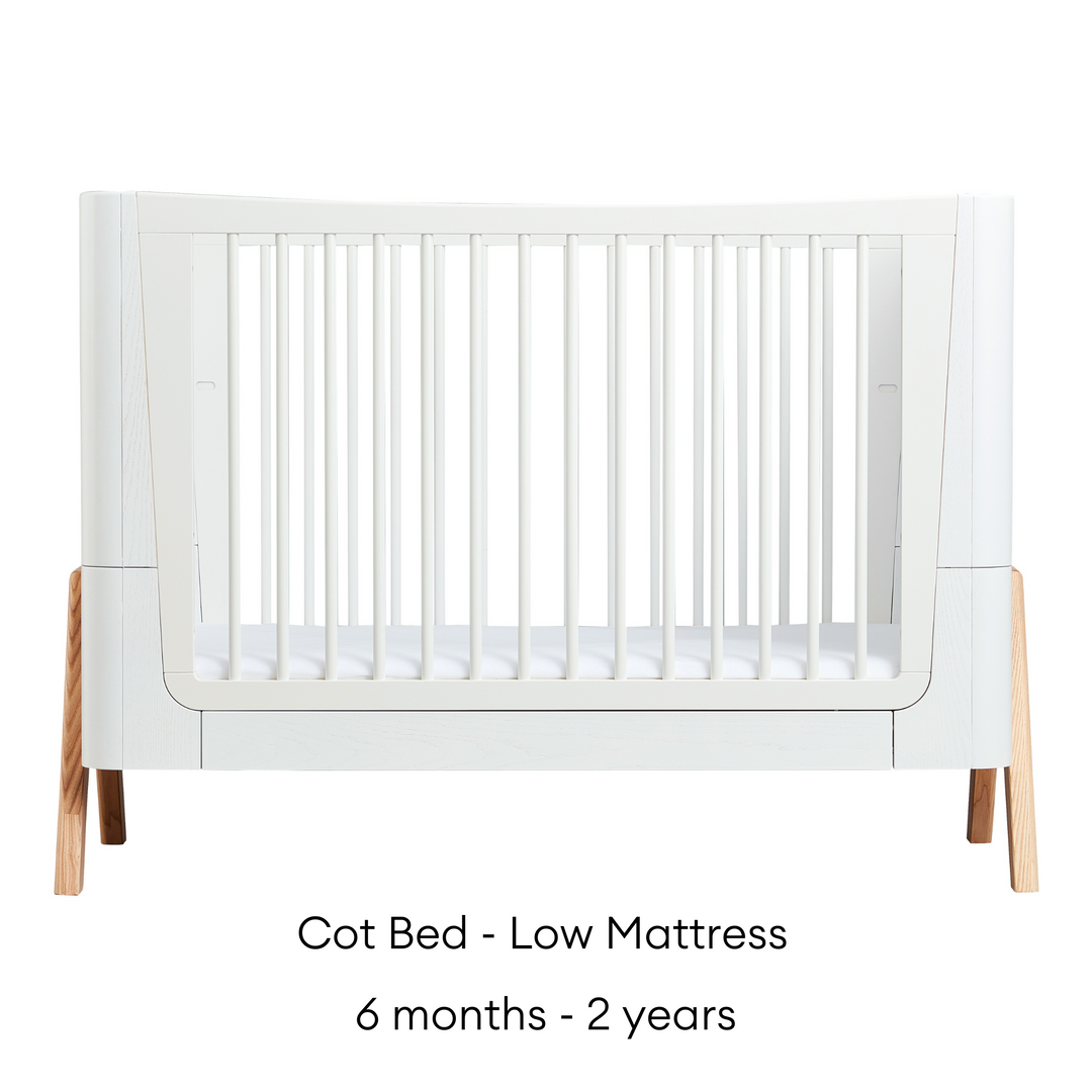 This image shows the stunning Gaia Baby Hera Cot Bed in the Scandi White colour swatch 