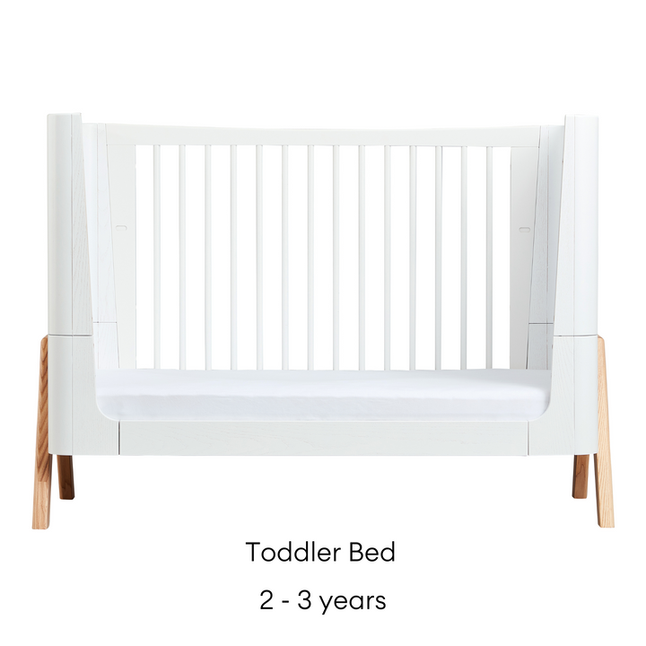 This image shows the stunning Gaia Baby Hera Cot Bed in the Scandi White colour swatch 