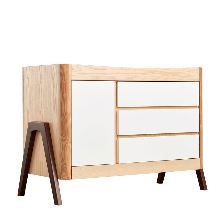 Gaia Baby Hera Dresser in Ash and Walnut. A Solid wood dresser with three drawers and a side cabinet.