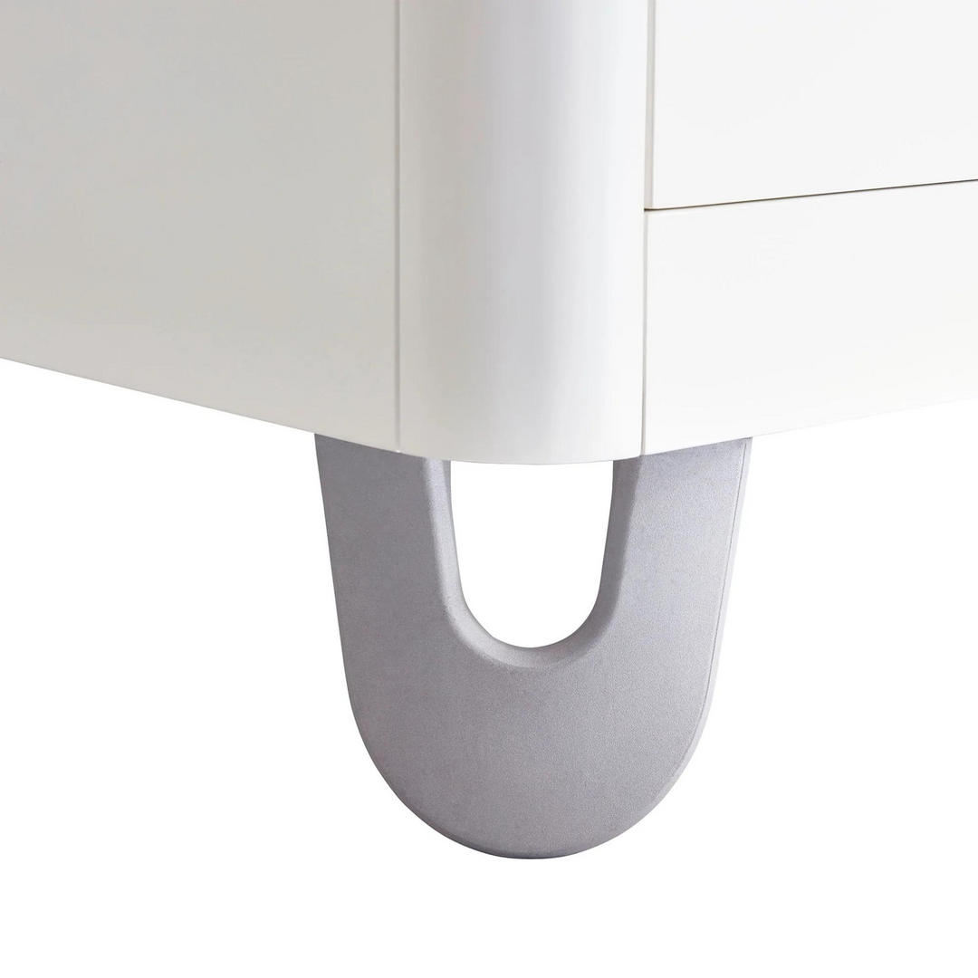 Gaia Baby Serena Dresser white. White modern dresser. Minimalist white solid wood dresser. Closeup of dresser leg